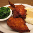 Coffee-shop fried chicken dinner with mashed potatoes and greens