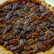 Dark, syrup-sweet pecan pie is further sweetened by a crowd of chocolate chips (and, not seen, bourbon).