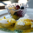 Soft-cooked eggs drizzled with hollandaise, perched on artichoke hearts, sided by creamed spinach