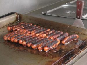 Bacon-wrapped hot dogs on the grill ... taste of Tucson