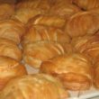 Airy, feather-light pastries arrayed for sale in a bakery