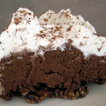 Dense, dark chocolate pie perches on a toasted-pecan crust