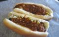 Hot dogs topped with chili and cole slaw