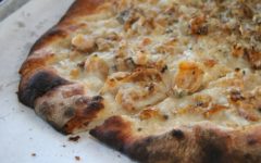 Char-crusted pizza speckled with clams, garlic, and herbs
