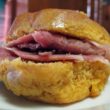 Orange sweet potato biscuit holds salty pink country ham