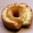 Yellow-orange buttermilk donut shows its cake-like interior