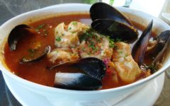 Mussels, prawns, and crabmeat pack a bowl of zesty red soup