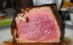 Tall, sliced-open rare filet mignon steak