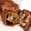 Slice into a babka loaf reveals a swirl of bready cake and chocolate