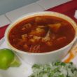 Peppery menudo comes with fresh limes for squeezing.