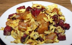 Eggs, potatoes, and salami -- all mixed up for breakfast