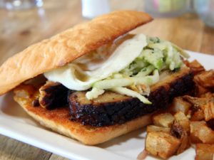 A breakfast sandwich of pork belly, shaved apple, fennel and egg for Breakfast in Tucson