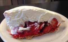 A slice of cream-topped stawberry ice box pie