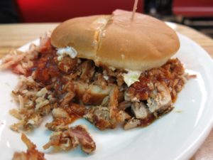 Sauced chopped pork shares space in a bun with cole slaw at McClard's Bar-B-Q