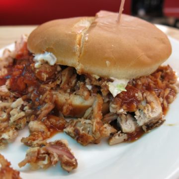 Sauced chopped pork shares space in a bun with cole slaw at McClard's Bar-B-Q