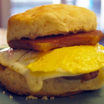Buttermilk biscuit sandwiches a tile of country ham and a fried egg