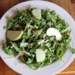 Arugula salad here includes apples, cheese & walnuts