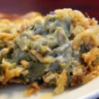 Green bean casserole moist with cream of mushroom soup and laced with crunchy wisps of fried onion