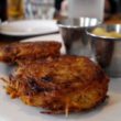 Thick, crunchy potato pancakes come with ramekins of sour cream and apple preserves