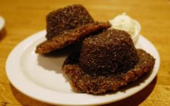 Plate holds two dark bran muffins, infused with honey