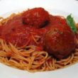 Traditional spaghetti with meatballs and sweet tomato sauce.