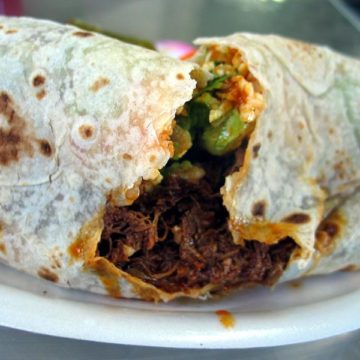 Opened-up burrito reveals chile-infused beef.
