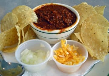 Bowl of chili with onions, cheese & chips ... chili nation