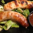 Grilled bratwurst served with spicy curry sauce