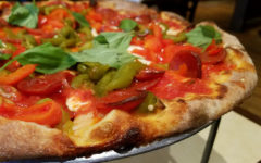 Crisp/chewy crust supports peppery pepperoni, roasted red and green peppers, buttery mozzarella, and fresh basil.