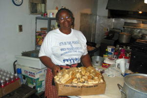 Rhoda Adams shows a box of tamales ... Mississippi Delta destination