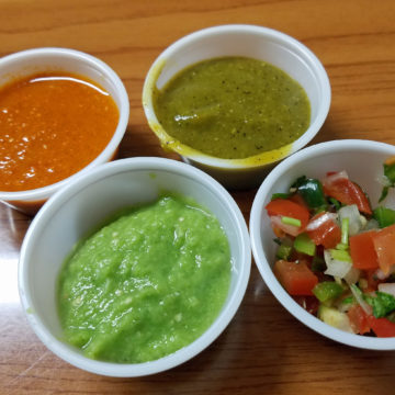 Four cups of salsa, ready to apply to a meal