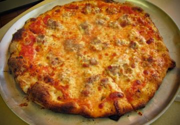 Sausage pizza with slight char on its crust