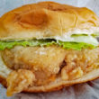 Boneless fried chicken breast sandwiched in a bun with lettuce and mayo
