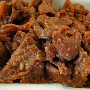 Close view of flaps of marinated, stir-fried beef