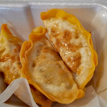 Light gold crescents are crisp-fried dumplings