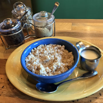 Bowl of oatmeal comes with a pitcher of milk plus raisins, walnuts, and brown sugar