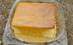In a plastic take-out container, this square of tender yellow cake oozes the butter-sweet flavor of caramel