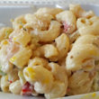 Peppers & pickles enhance elbow macaroni salad.