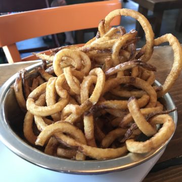 A bowl filled with curly fries