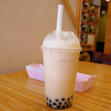 Large plastic cup of bubble tea comes with a large-gauge straw big enough to suck up the tapioca bubbles