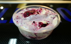 Thick Greek yogurt is veined with dark purple marionberries