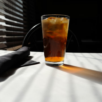 Sweet tea in the afternoon light at a southern cafe counter