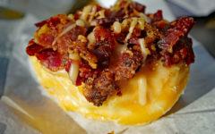 A sticky sweet donut with maple bacon on top from Donutland
