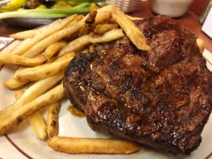 A big, juicy ribeye steak and fries at Jocko's