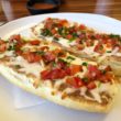 With creamy refried beans as a major ingrediente, the mollete resembles a French-bread pizza, or Italian bruschetta