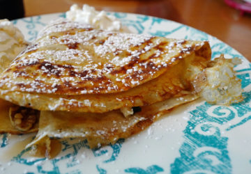 Paper-thin crepes, dusted with powdered sugar, envelop bananas, walnuts, maple syrup and brown sugar