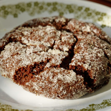 Fissured, thick, dark cookie contains chewy little bits of candied ginger.