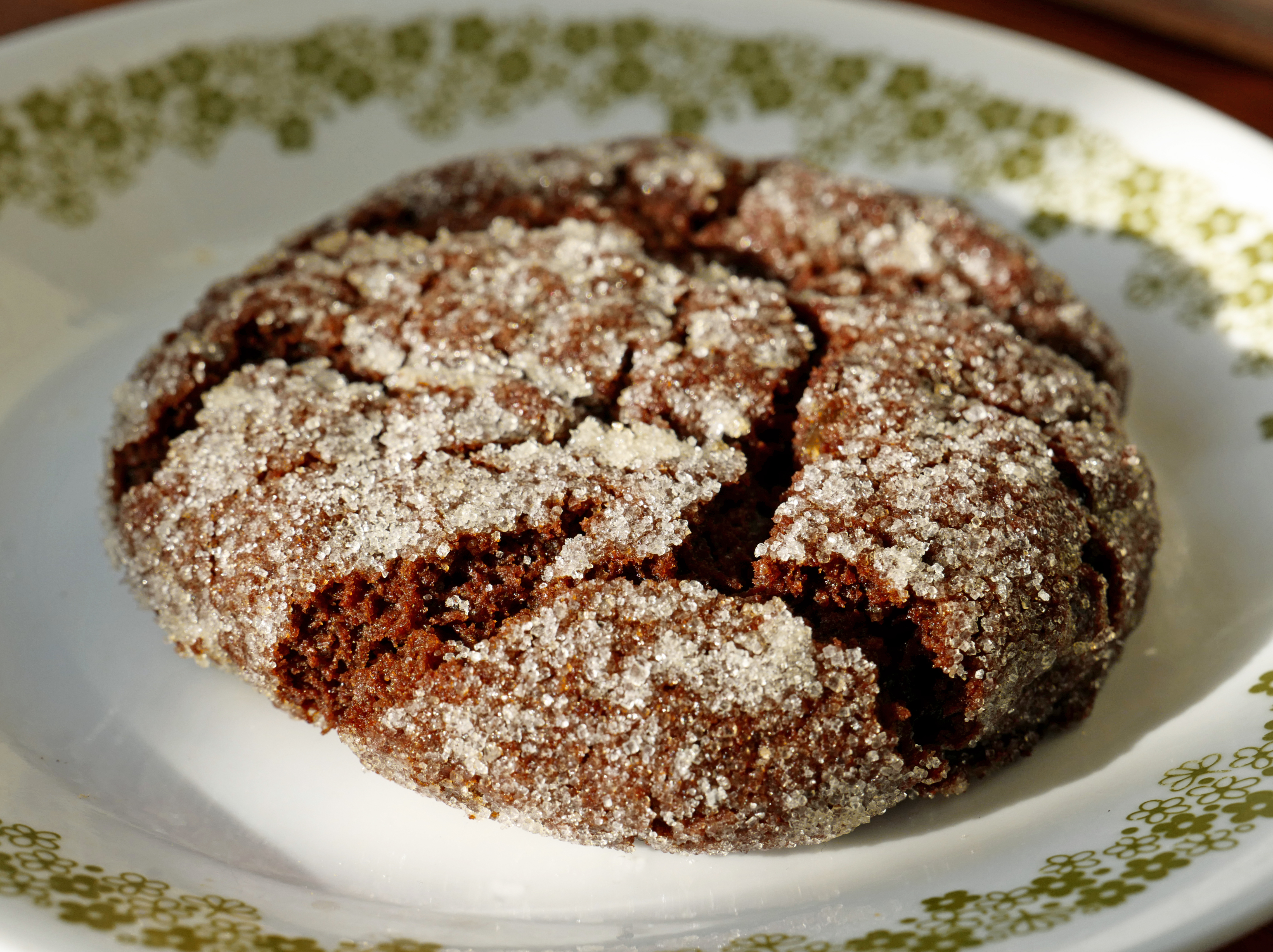 Fissured, thick, dark cookie contains chewy little bits of candied ginger.