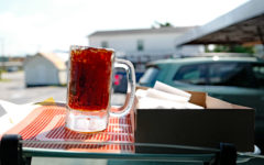 Frosted mug of root beer on a drive-in car tray