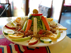 Tall Mexican topopo salad features plenty of carne seca.
